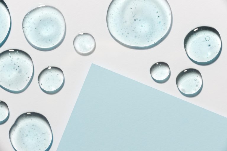 top-view-hydro-alcoholic-gel-drops-with-paper